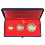 Three coin boxed 25th Anniversary Desert War Commemorative 18 carat gold medals.
