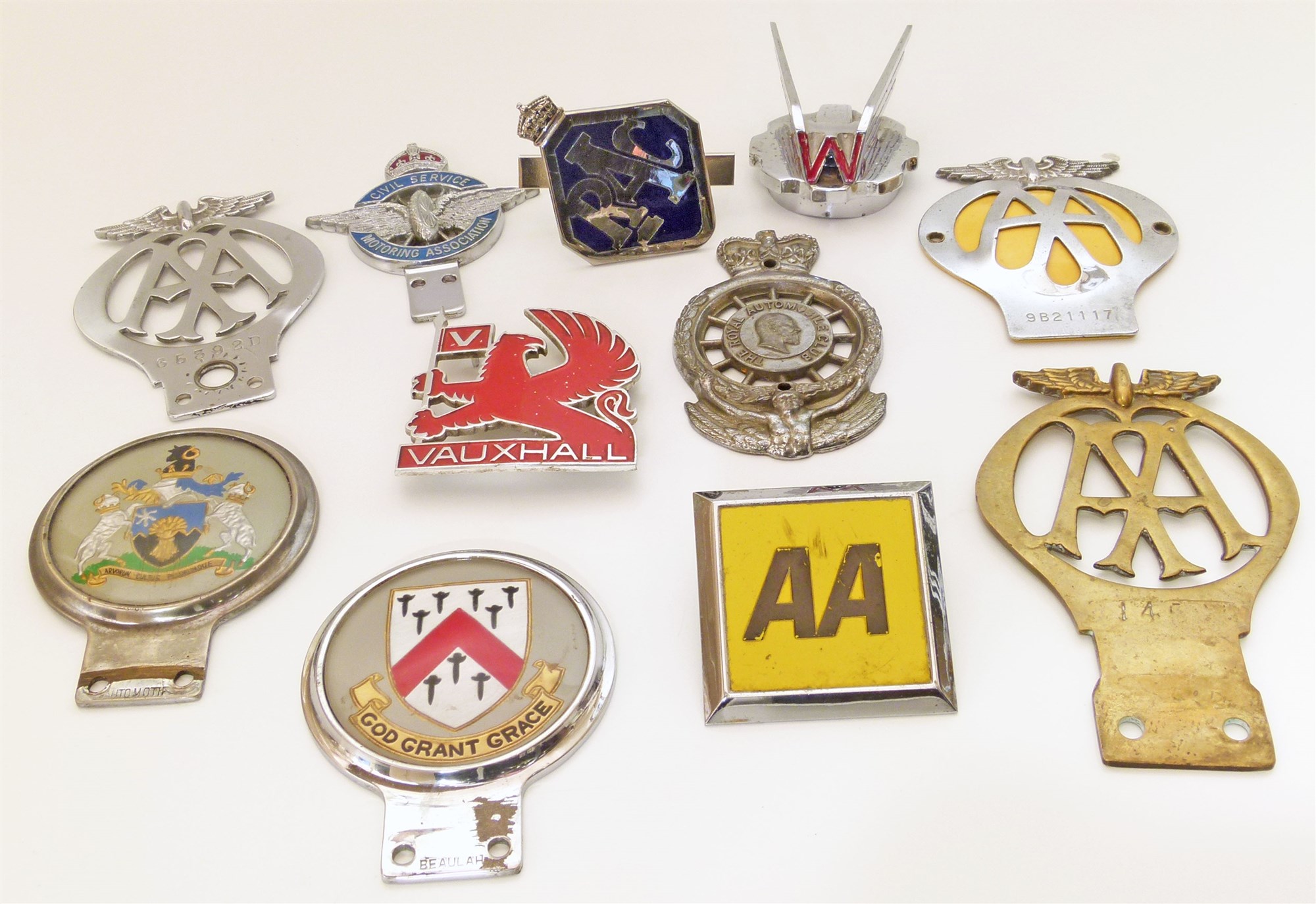 A collection of eleven car badges to include RAC full members type 14 1969-1975, 1990's Member