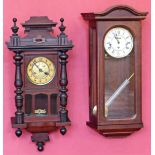 Two wall clocks, one Edwardian striking on a single gong and the other late 20th century with