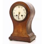 An Edwardian mahogany and inlaid balloon mantle clock complete with key Unfortunately we are not