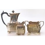 A pair of silver sugar tongs and three silver plated items (coffee pot, milk jug and tureen)