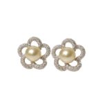 Pair of cultured pearl and diamond set 18ct white gold cluster earrings , the stylized flower head