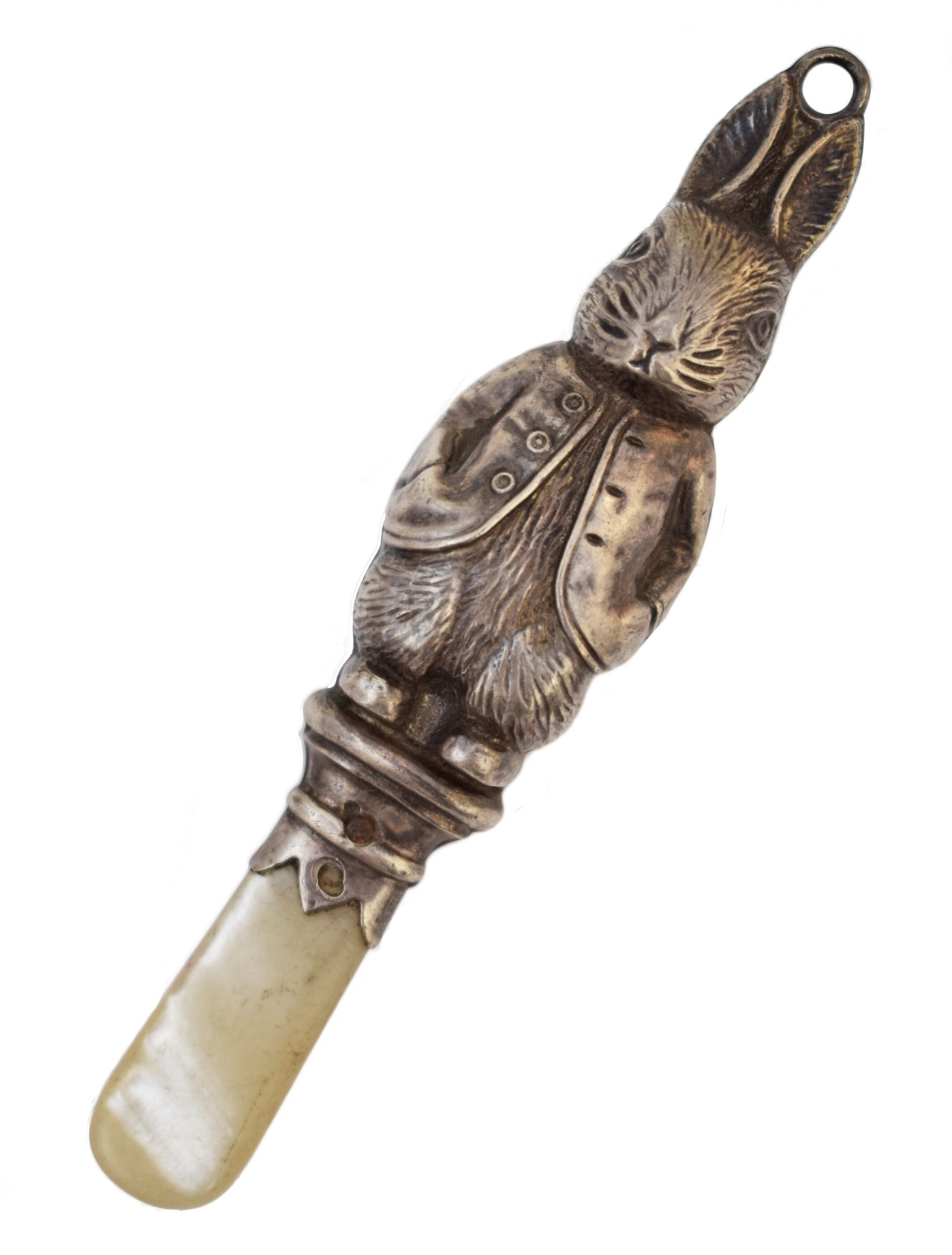 Silver baby rattle in the form of Peter Rabbit , hollow carved body with loop fitting to ears on