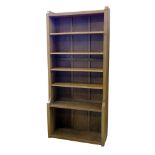 Robert "Mouseman" Thompson floor standing bookcase, fitted four adjustable shelves with fixed