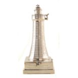 Silver presentation table lighter in the form of a lighthouse of sailing interest , 20cm high,