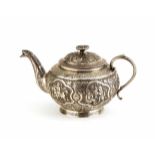 Small Persian silver teapot, round squat body, spout and handle chased with floral and foliate