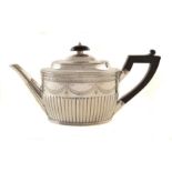 Victorian silver teapot , oval form with fluted lower body, with finely chased floral and garland