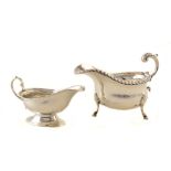 Silver sauce-boat , traditional three legged form, scroll handle with acanthus leaf decoration, rope