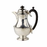 Silver jug, baluster body on pedestal foot, black C-scroll handle and finial to hinged lid, marks