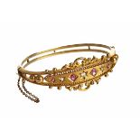 Victorian diamond and ruby Etruscan style gold bangle, 9ct gold oval hinged bangle, central panel