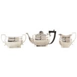 A 3-piece silver tea set , rounded rectangular forms with scalloped corners, hinged lid, faceted