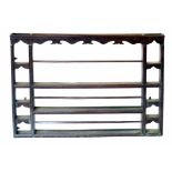 Late 18th century oak Delft rack, blind fretwork to cornice with moulded edge, three central shelves