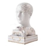 F. Bridges Pottery inkwell phrenology head, heightened in gilt with impressed mark to front of base,