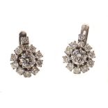 Pair of diamond cluster white gold stud earrings , the two central brilliant cut diamond weighing