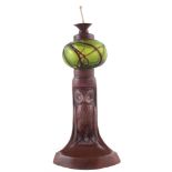 Loetz style chamber stick , with iridescent green trailed glass globe fitted on bronze owl base,