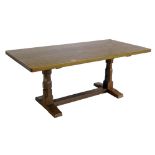 Robert "Mouseman" Thompson dining table, the rectangular top with adzed finish, standing on two