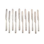 12 piece set of silver dessert knives and forks , filled silver handles chased with foliate and