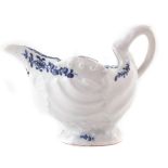 Lowestoft shell moulded ewer circa 1770, painted in blue with flowers, 7.5cm high