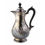 Victorian silver lidded jug, embossed fluted decoration to body, plain polished neck, black scroll