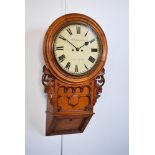 A late 19th century oak drop dial wall clock by Swindon & Sons, Birmingham. Pierced, carved wings to