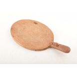 Robert "Mouseman" Thompson oval cheese board with single handle decorated with trademark mouse, 38cm