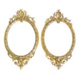 Pair of Victorian wall mirrors, each with oval gesso frames decorated with flower and shell