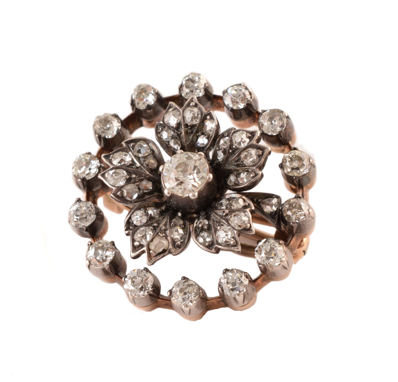 Victorian diamond circular floral brooch , central old cut diamond with a surround of five