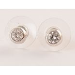 Pair of diamond solitaire 18ct white gold stud earrings , two brilliant cut diamonds weighing a