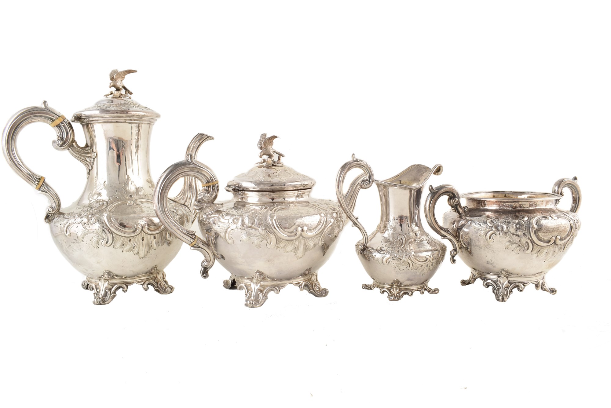 A Victorian silver four-piece tea and coffee set , teapot of squat baluster form on four scrolling