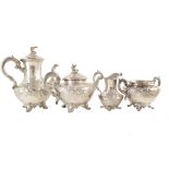 A Victorian silver four-piece tea and coffee set , teapot of squat baluster form on four scrolling