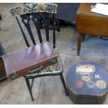 Travelling hat box with "Cunard" and "Bibby" line labels, small suitcase and bedroom chair.