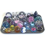 Thirteen Caithness paperweights, a Selkirk weight, Murano weight, Mdina weight and eight others