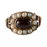 A Georgian garnet and seed pearl cluster mourning ring, The cushion shaped head engraved to