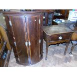 A George III bow-fronted two door mahogany corner cupboard and small side table Unfortunately we are