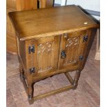 A reproduction oak two-door cabinet with Gothic doors 50cm wide Unfortunately we are not doing