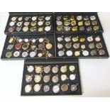 Eighty-nine assorted base metal costume pocket watches of various designs complete in presentation