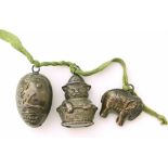 Three rattle charms, to include one egg-shaped charm with "mother Goose" motif, one silver cat in