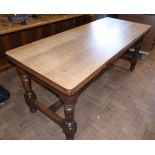 An early 20th century oak refectory style dining table on turned legs 180cm X 74cm Unfortunately