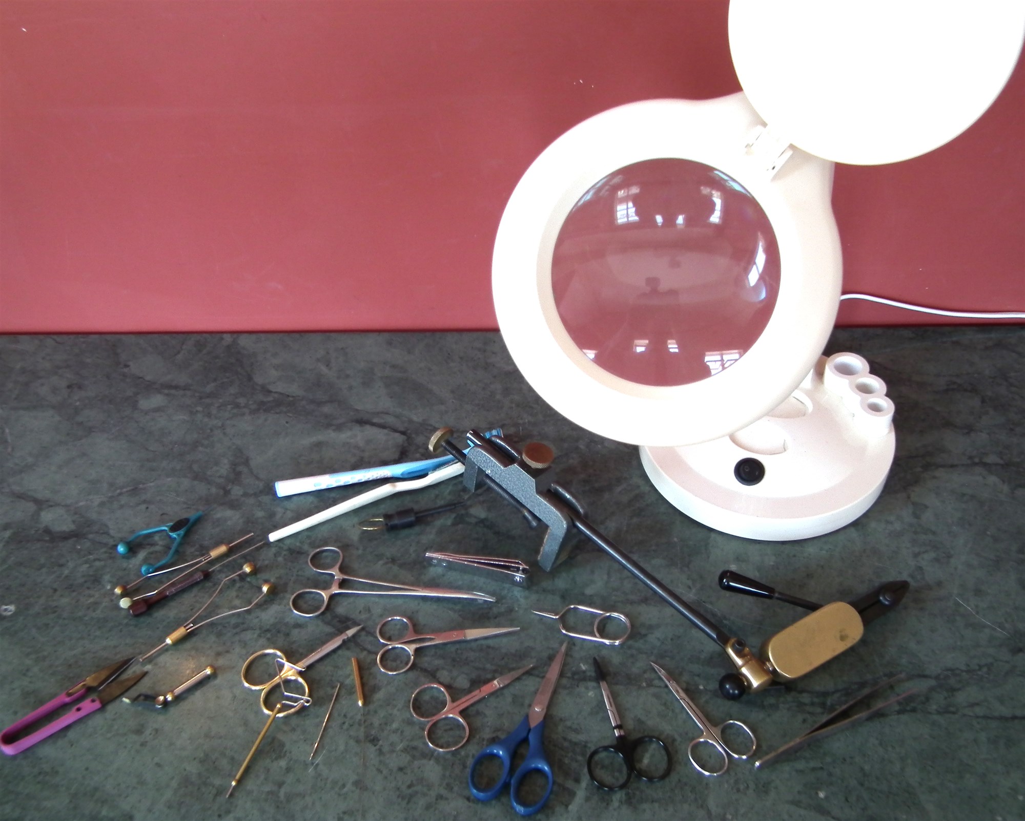 Collection of fly tying tools including Integra vice, six pairs of scissors by Veniard, mashama,