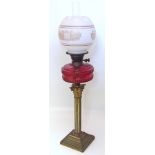 A Victorian brass oil lamp with Corinthian column Unfortunately we are not doing condition reports