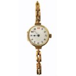 A 9ct gold Ladies' wristwatch, 1922, on 9ct gold expanding strap Unfortunately we are not doing