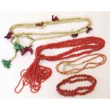 Three assorted coral necklaces, one branch coral, one pink-white coral, one woven necklace and two