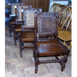 Four mahogany Jacobean style dining chairs with barley-twist supports and cane back. Unfortunately