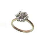 An 18ct white gold flower head diamond-set ring Unfortunately we are not doing condition reports