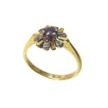 An 18ct gold sapphire and diamond flower head ring Unfortunately we are not doing condition