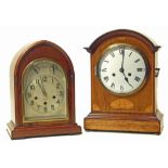 One oak mantel clock with marquetry inlay, two-train striking single gong and a lancet arched oak