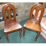 Pair of Victorian Gothic oak hall chairs. Unfortunately we are not doing condition reports on this