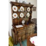 Reproduction oak dresser with plate rack. Unfortunately we are not doing condition reports on this