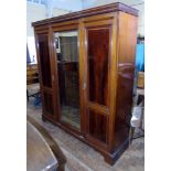 An Edwardian mahogany and inlaid wardrobe with centre mirror door Unfortunately we are not doing