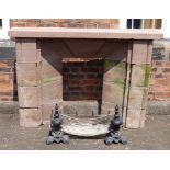 An early 19th century cut sandstone fireplace complete with cast iron dog grate Condition reports